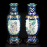 A set of (2) cloisonne vases with an enamelled depiction of Chinese figures in the centre. China, 2n