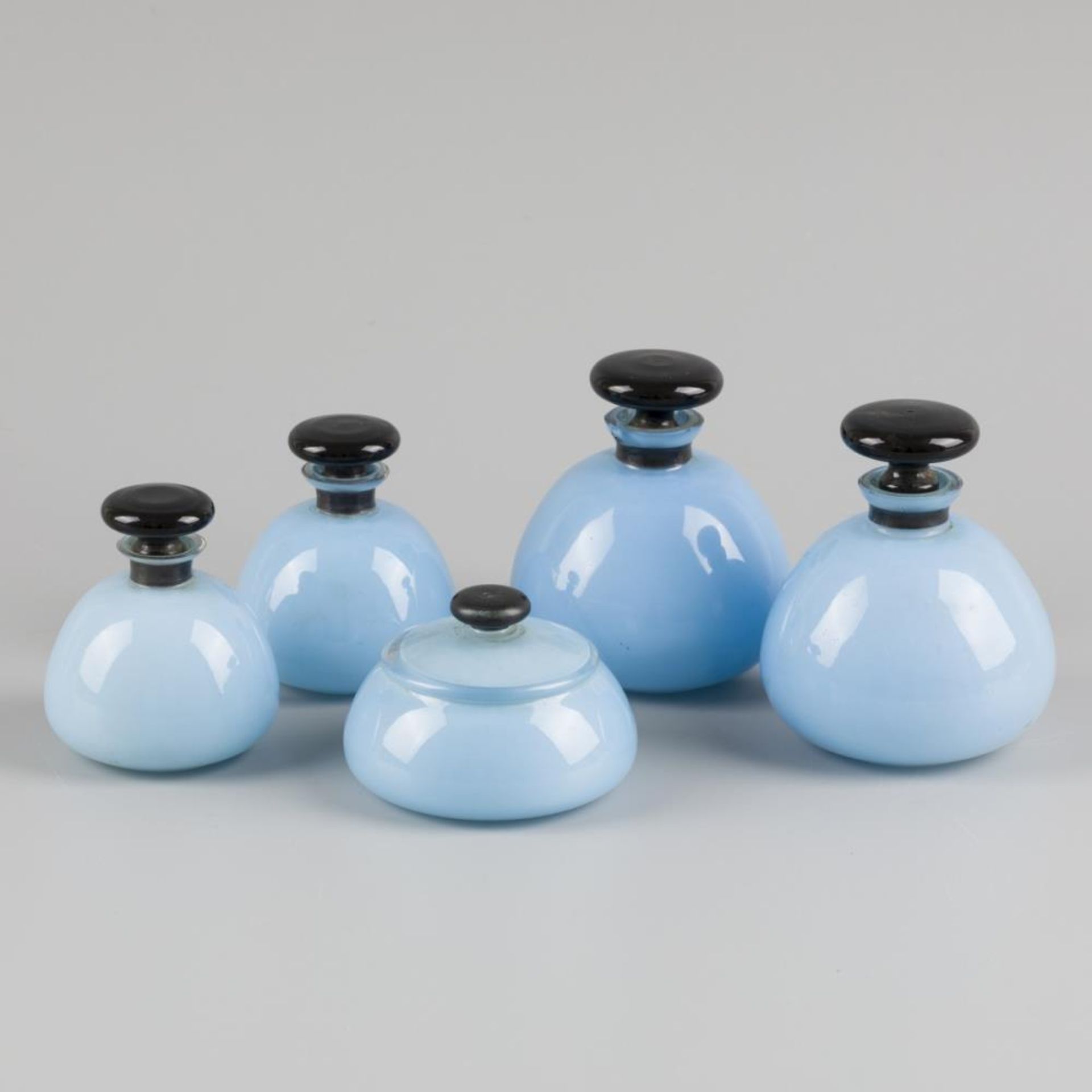 A (5) piece art deco style toiletry set, sky blue glass with black band, Germany, ca. 1920.