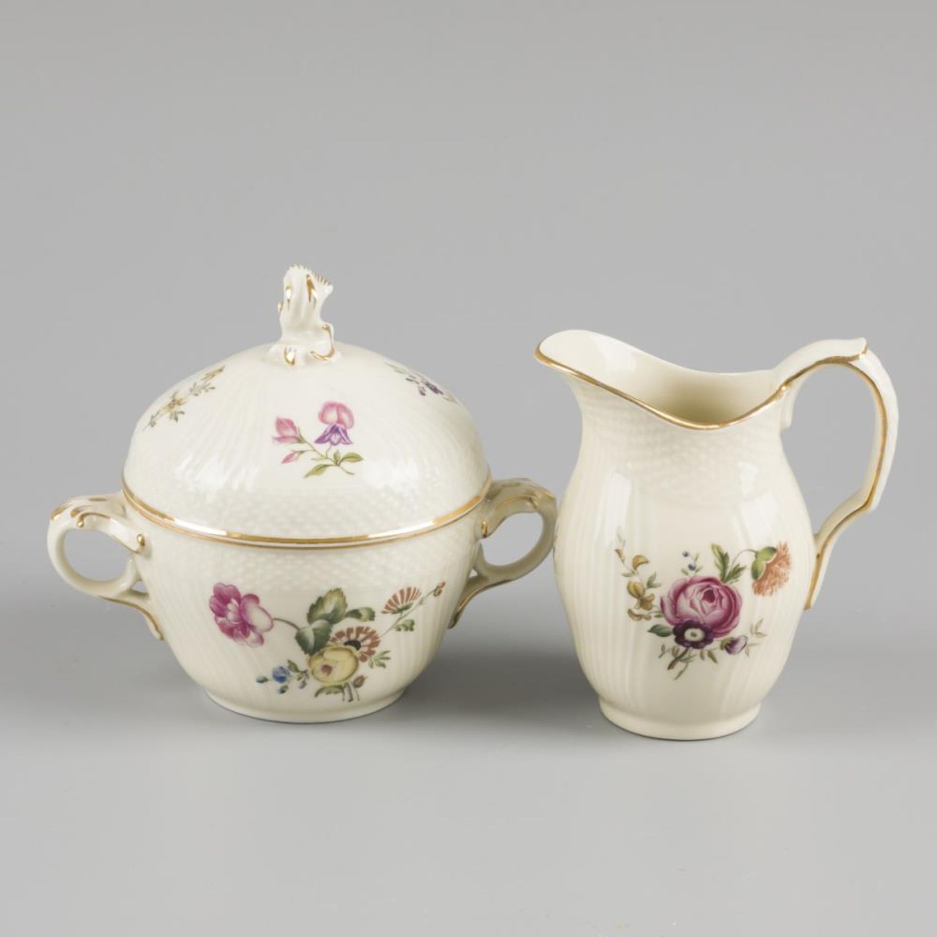 A porcelain cream set decorated with flowers, marked Royal Copenhagen. Denmark, 20th century.