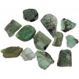 Lot of 12 uncut emeralds.