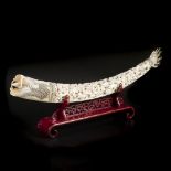 A large sculpted ivory tooth decorated with dragons. China, early 20th century.