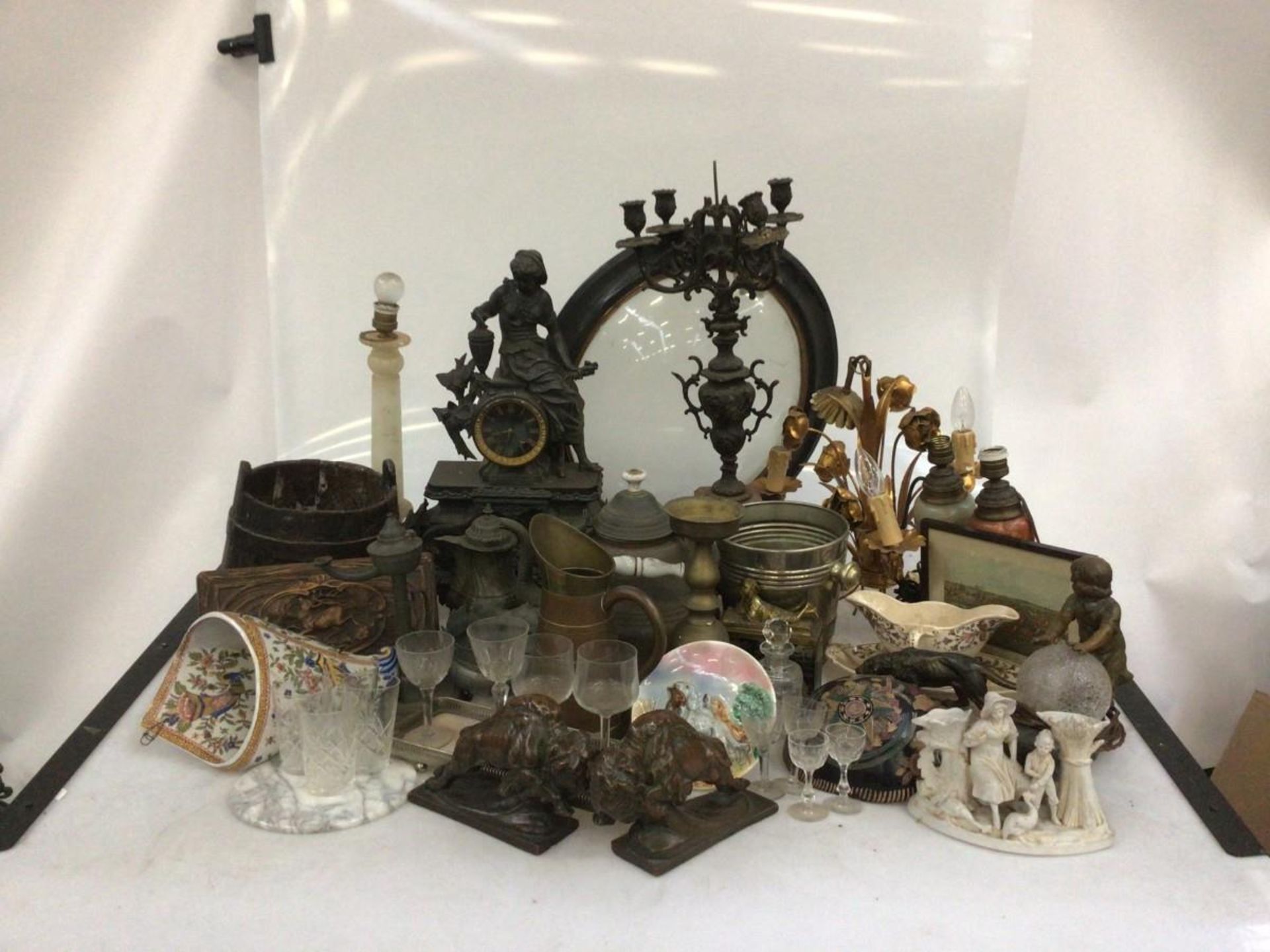 A large lot containing a milk bucket, a candlestick, various copper and tin work, a pair of cast boo