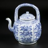 A porcelain wine jug with floral decoration in compartments. China, Wanli.