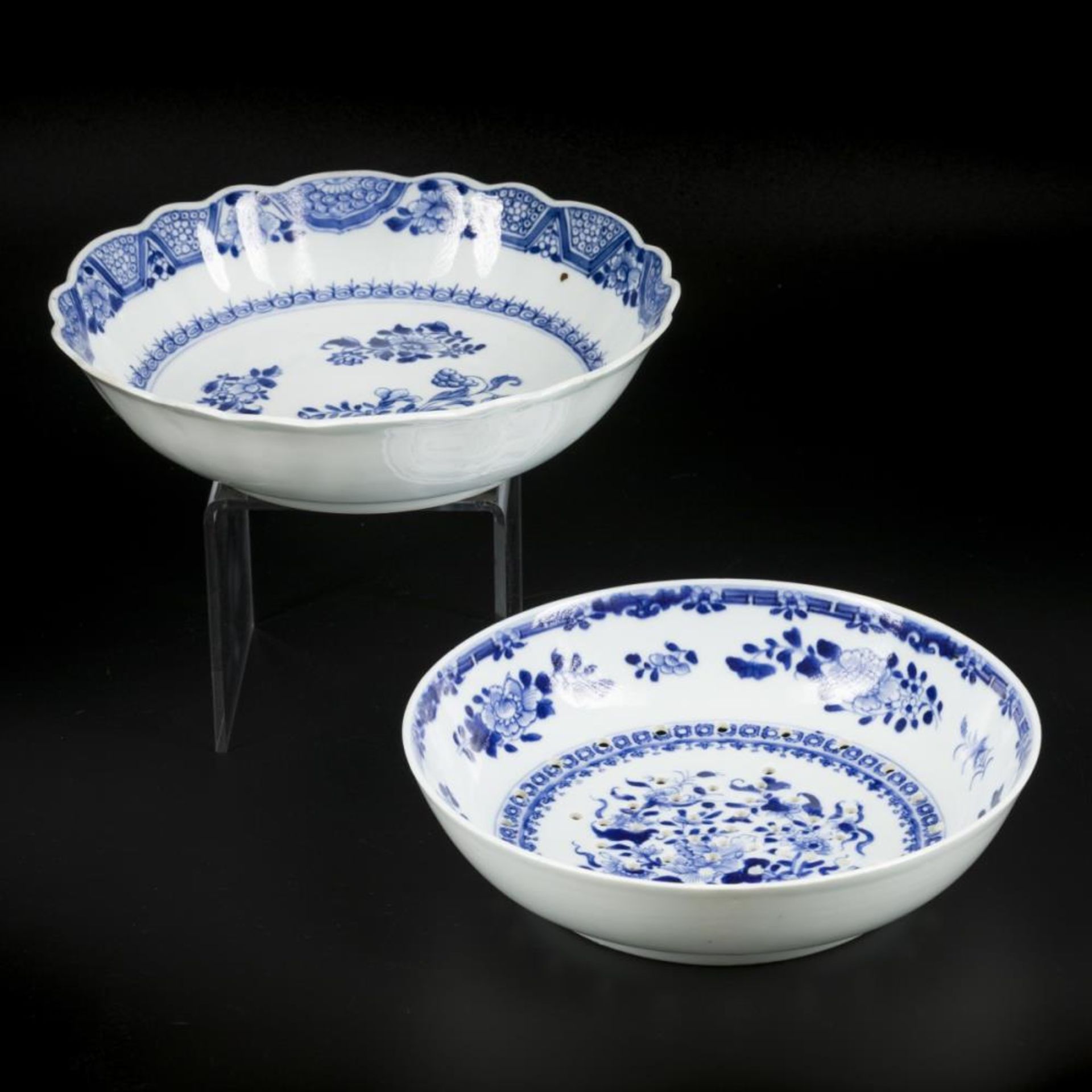 A porcelain bowl and a colander, both with floral decoration China, Qianlong 18th century.