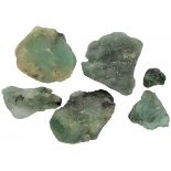 Lot of 6 uncut emeralds.