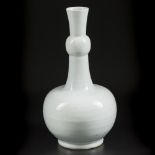 A Dehua blanc de Chine knobbly vase with relief decoration of flowers. China, Kangxi.