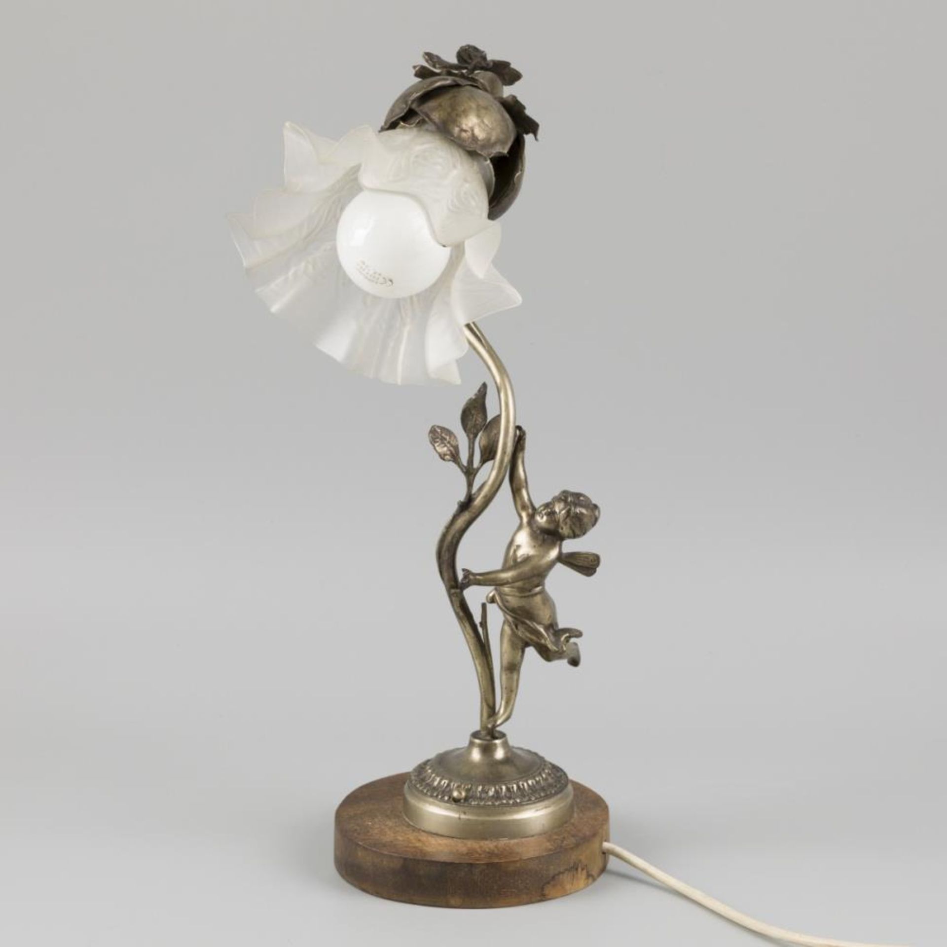 A metal table lamp shaped as a flower on a stem, 20th century.