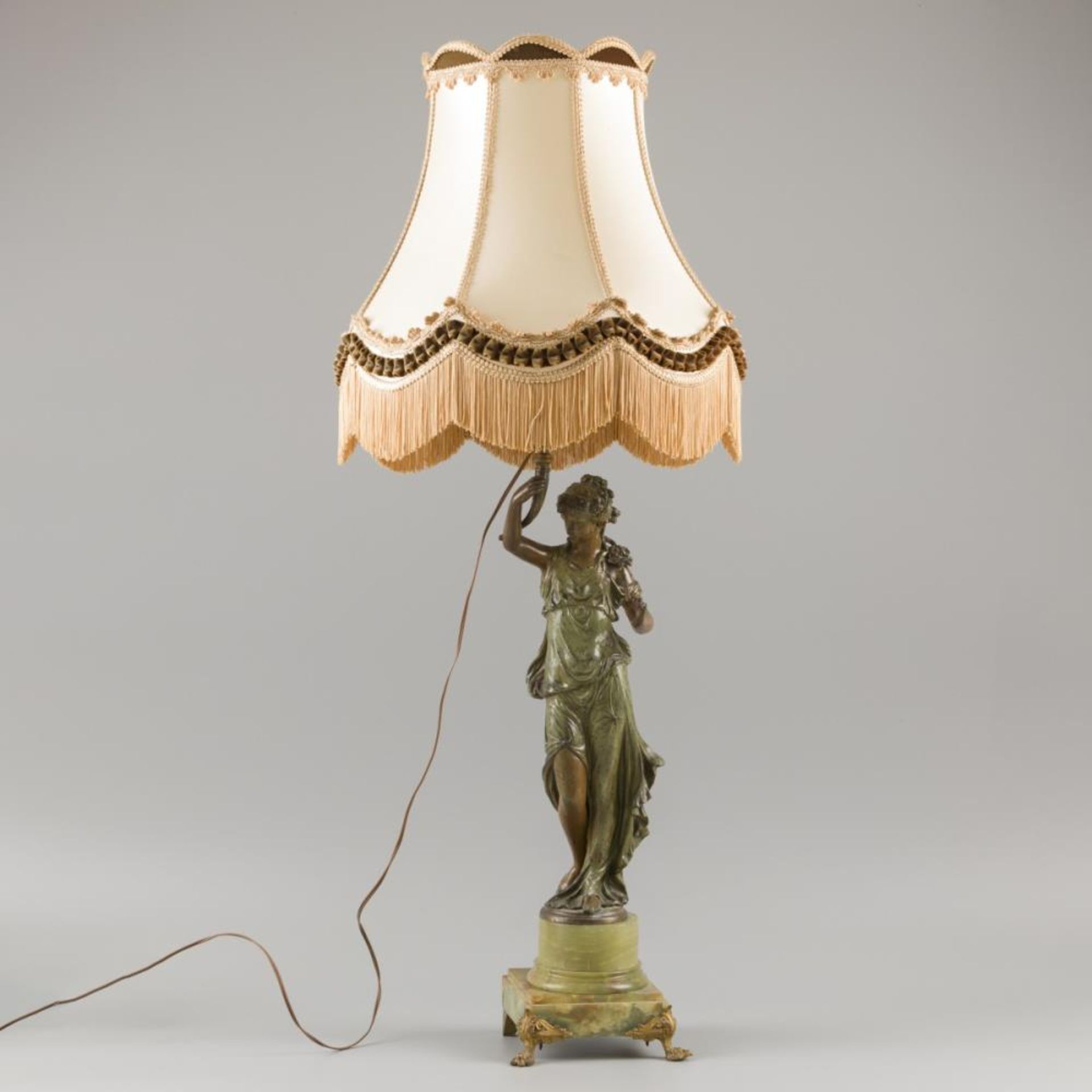 A table lamp depicting Flora holding a light, 20th century.