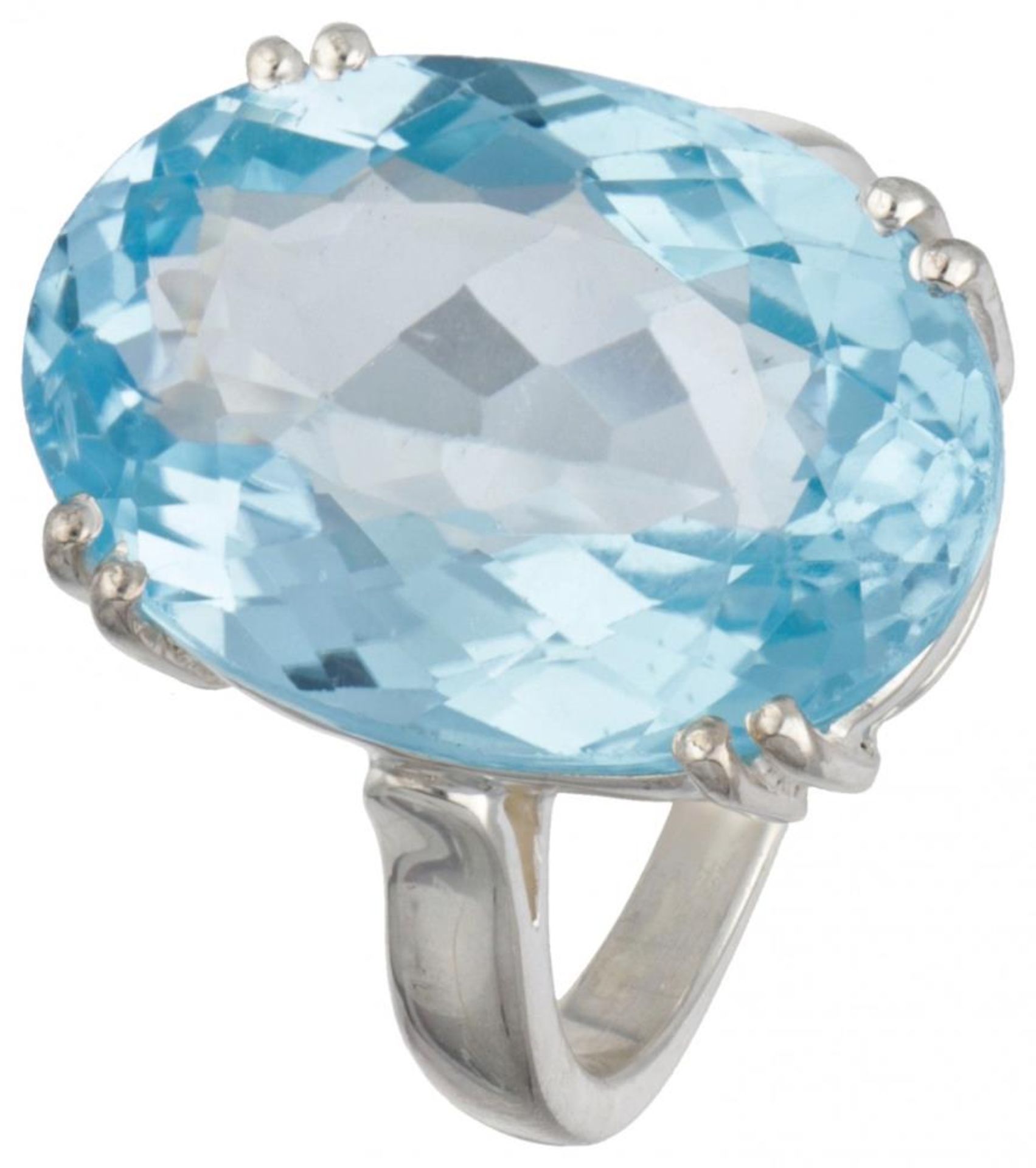 Sterling silver solitaire ring set with blue topaz.