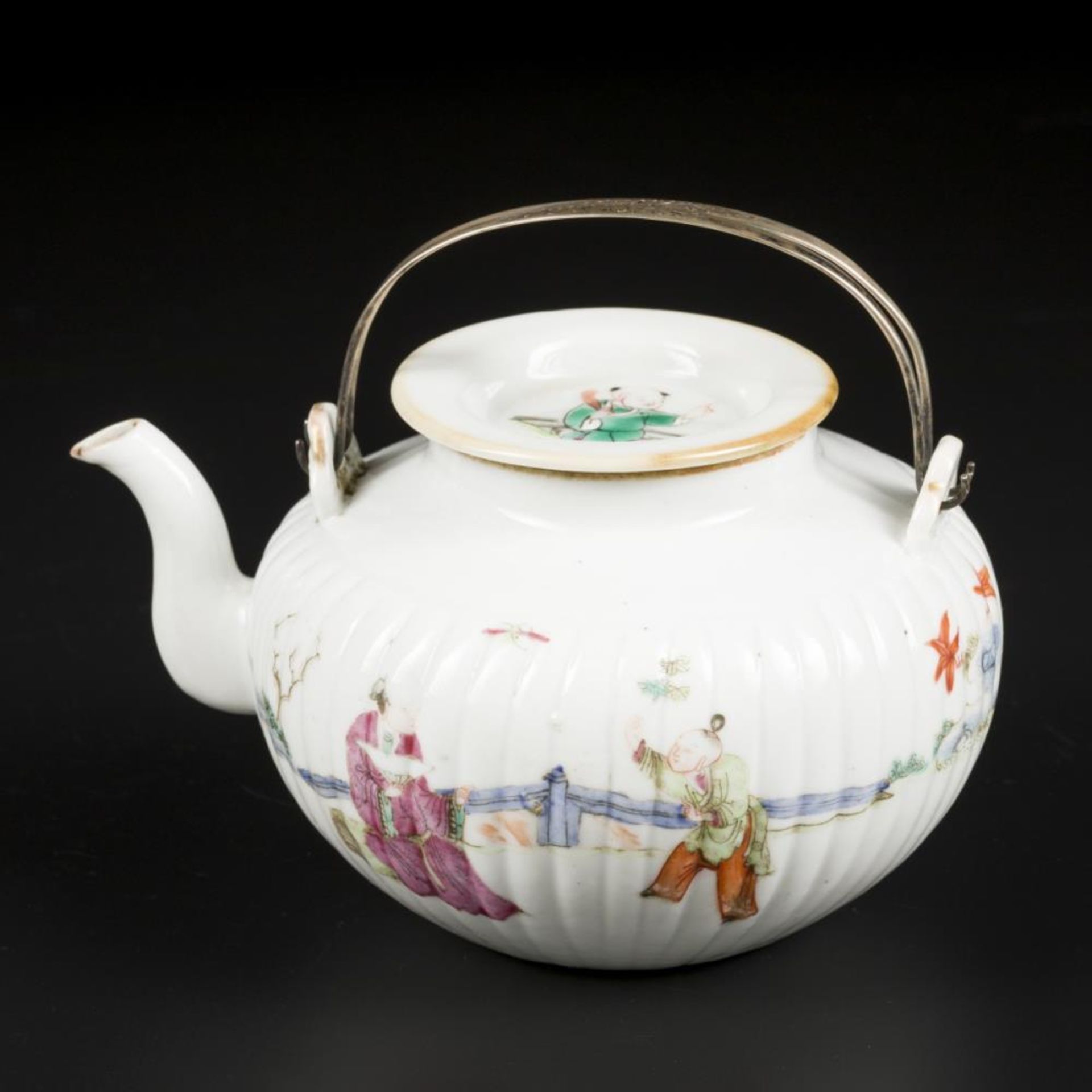 A porcelain famille rose teapot decorated with various figures. China, Republic period.