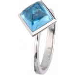 18K. White gold ring set with approx. 0.22 ct. diamond and blue topaz.