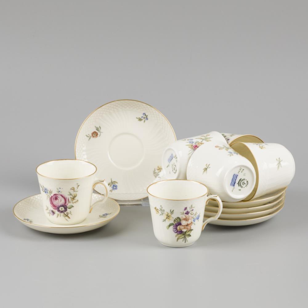 A set of (6) porcelain mocha cups and saucers decorated with flowers, marked Royal Copenhagen. Denma