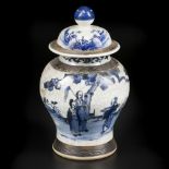 A porcelain lidded jar with landscape with figures decor. China, 19th century.