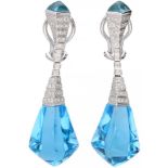 18K. White gold earrings set with approx. 0.50 ct. diamond and blue topaz.