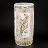 A very large porcelain famille verte cylinder vase decorated with various plants and trees. China, 2