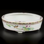 A porcelain famille rose bowl decorated with birds and flowers, marked Zhogguo Jingdezhen Zhi. China