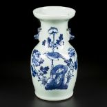 A porcelain vase with celadon fond decorated with a bird among the flowers. China, 19th century.