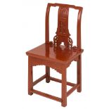 A red painted Chinese chair.
