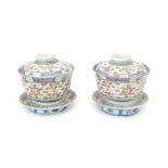 Two Chinese porselain cups with lids on stand.