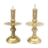 A pair of bronze collar candlesticks with pin, 17th/18th century.