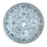 A Chinese blue-white stoneware dish with floral decor, 17th century