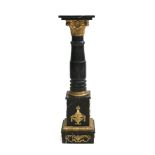 A black marble column in the style of empire with gilded ornaments, 20th century.