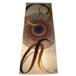 A large hand woven wall tapestry decorated with circular shapes and alfa and omega, signed lower