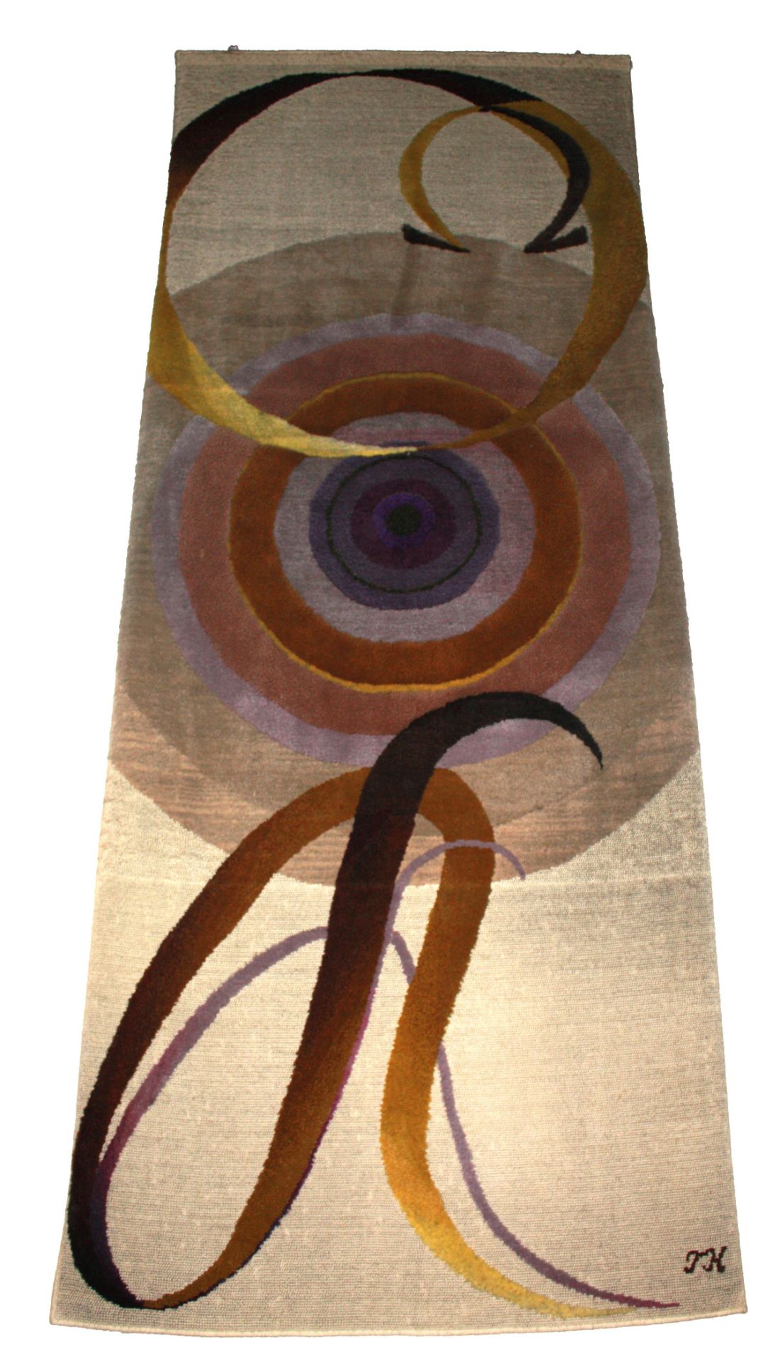 A large hand woven wall tapestry decorated with circular shapes and alfa and omega, signed lower