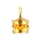 An 18 karat gold diamond and citrine pendant