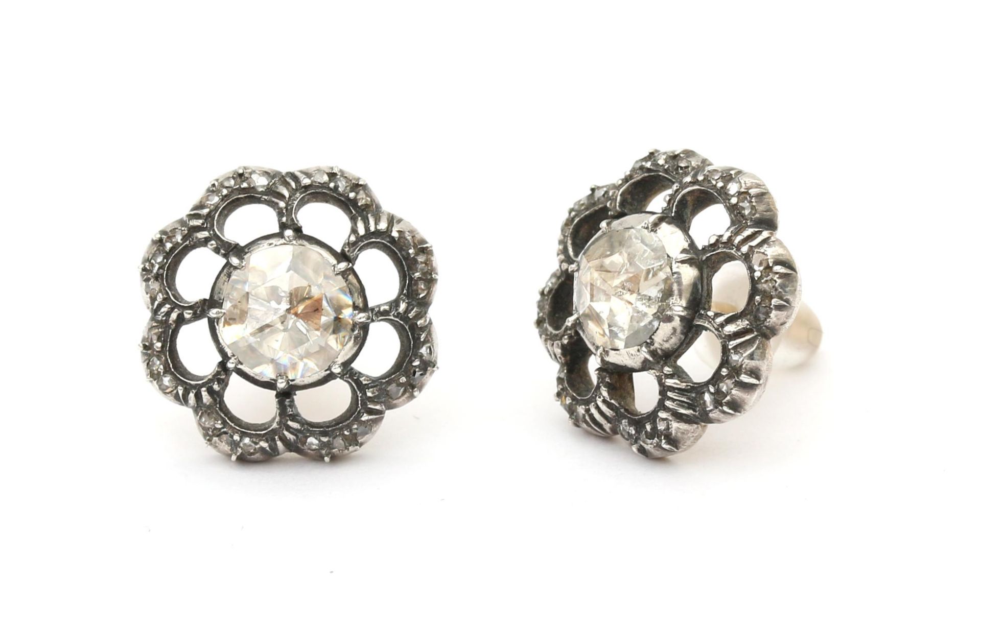 A pair of 14 karat gold and silver rose cut diamond ear studs