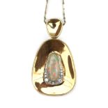 A 14 gold necklace with an opal and diamond pendant