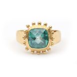 A 14 karat yellow gold topaz ring