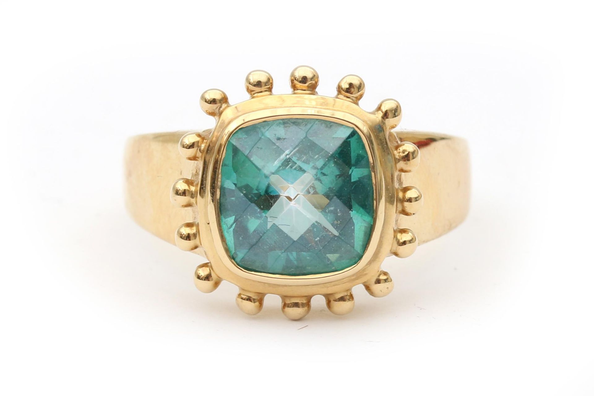 A 14 karat yellow gold topaz ring