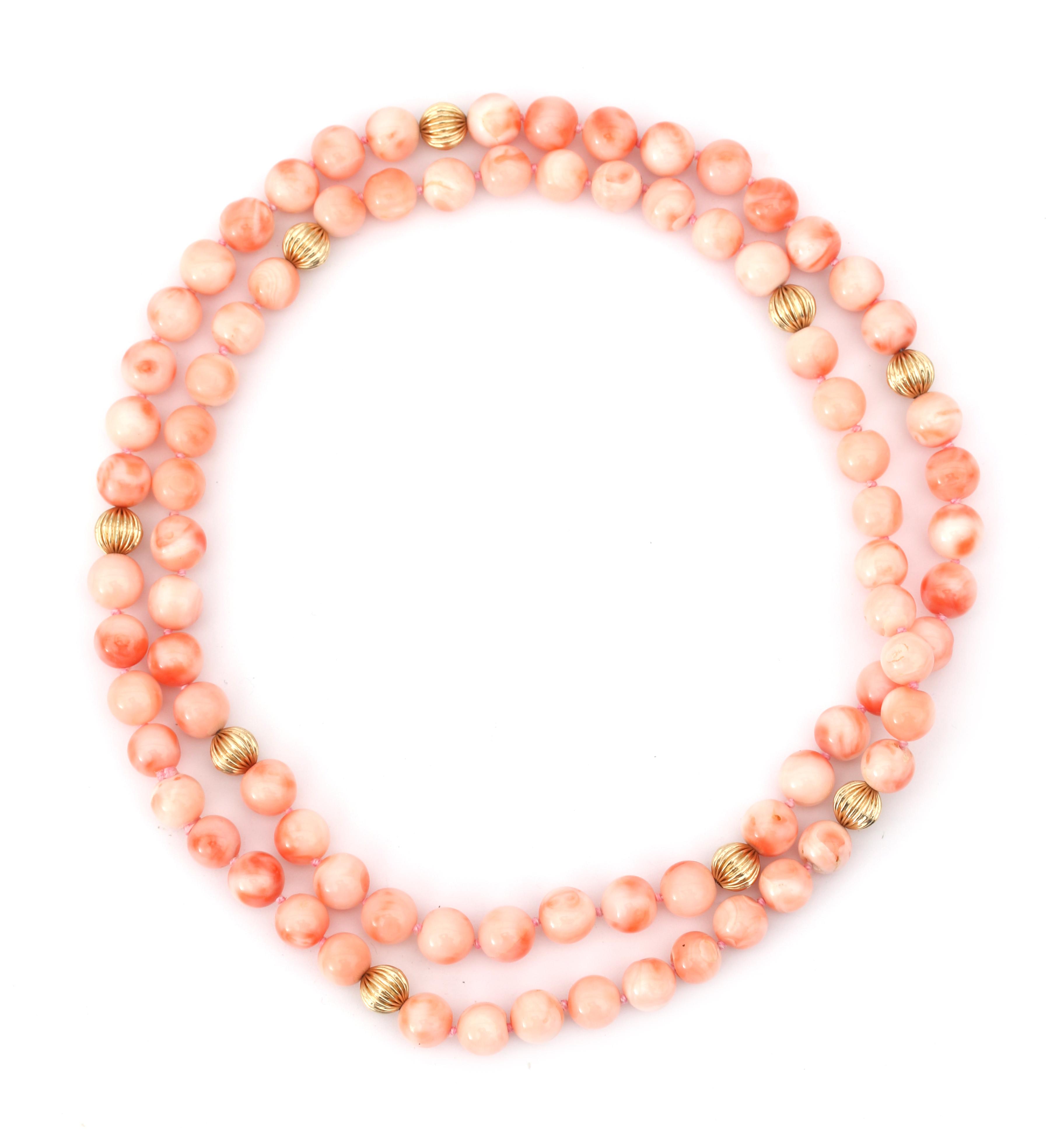 An angelskin coral bead necklace with gold spacers