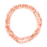 An angelskin coral bead necklace with gold spacers