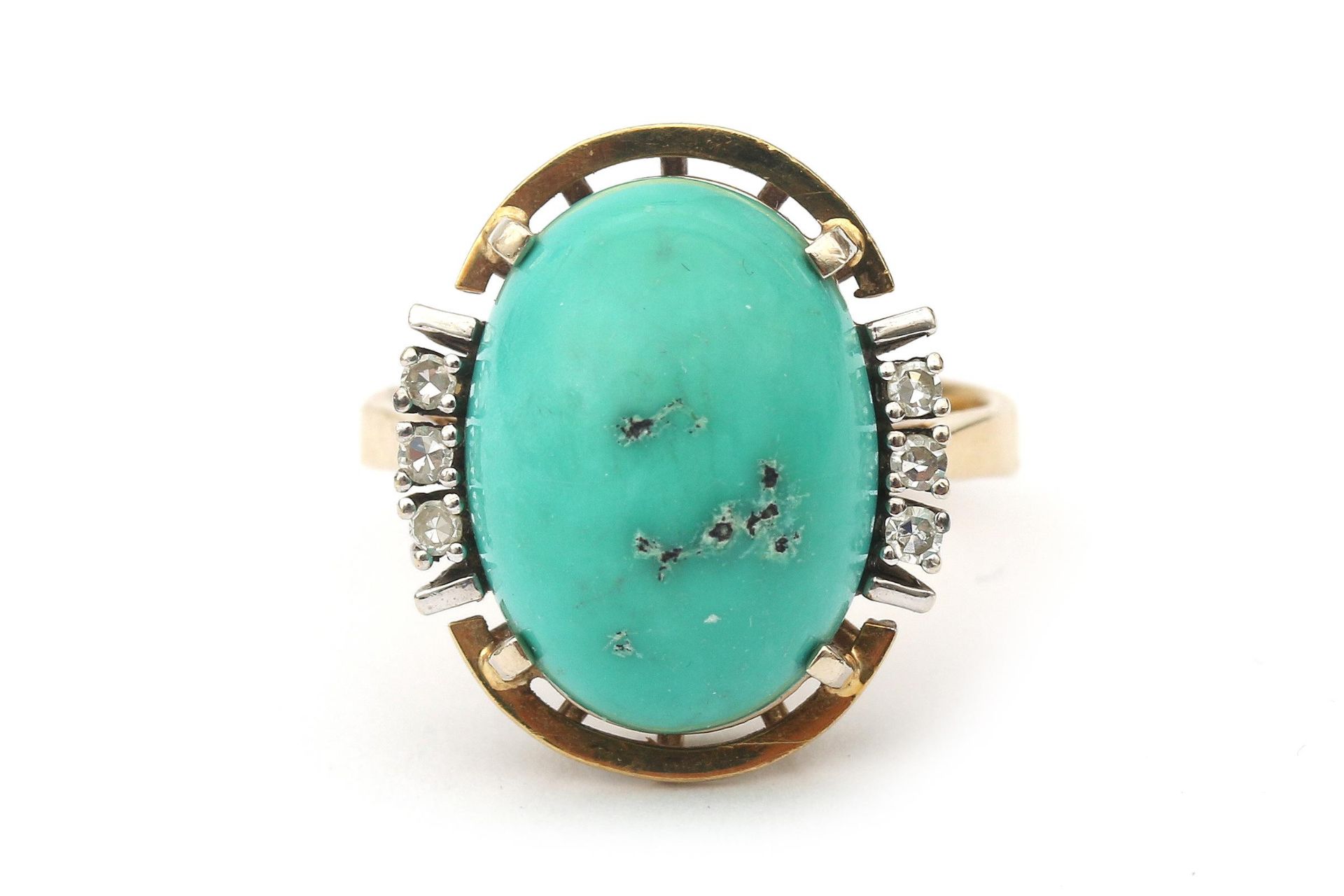 A 14 karat turquoise and diamond ring
