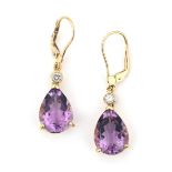 A pair of 18 karat gold diamond and amethyst earrings