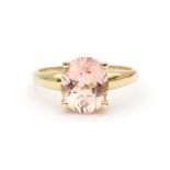 A 14 karat gold rose quartz solitaire ring