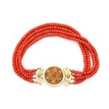 A precious coral four strand neckace to a 14 carat gold clasp