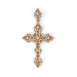 An 18 karat gold and platinum diamond cross pendant