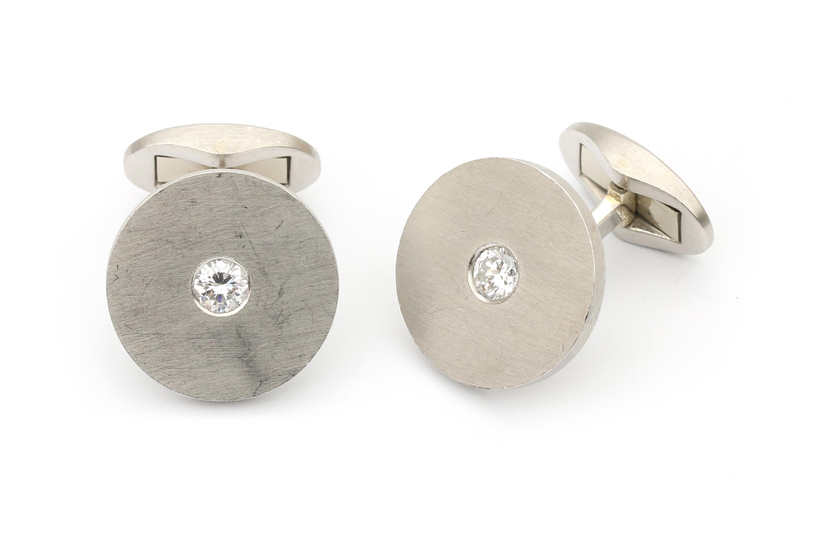 A pair of platinum diamond cuff links