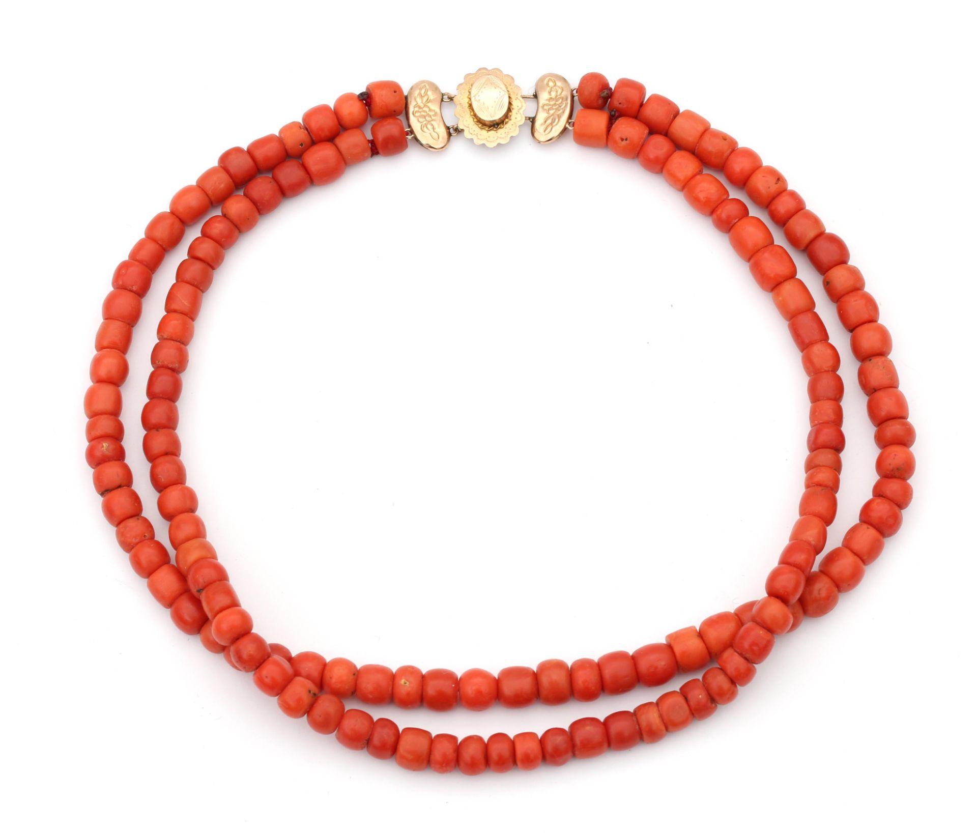 A precious coral two strand necklace on a 14 karat gold clasp