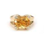 An 18 karat yellow gold citrine and diamond ring