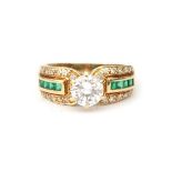 An 18 karat gold emerald and diamond solitaire ring, 1.07 ct.