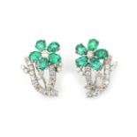 A pair of 18 karat white gold emerald and diamond earrings