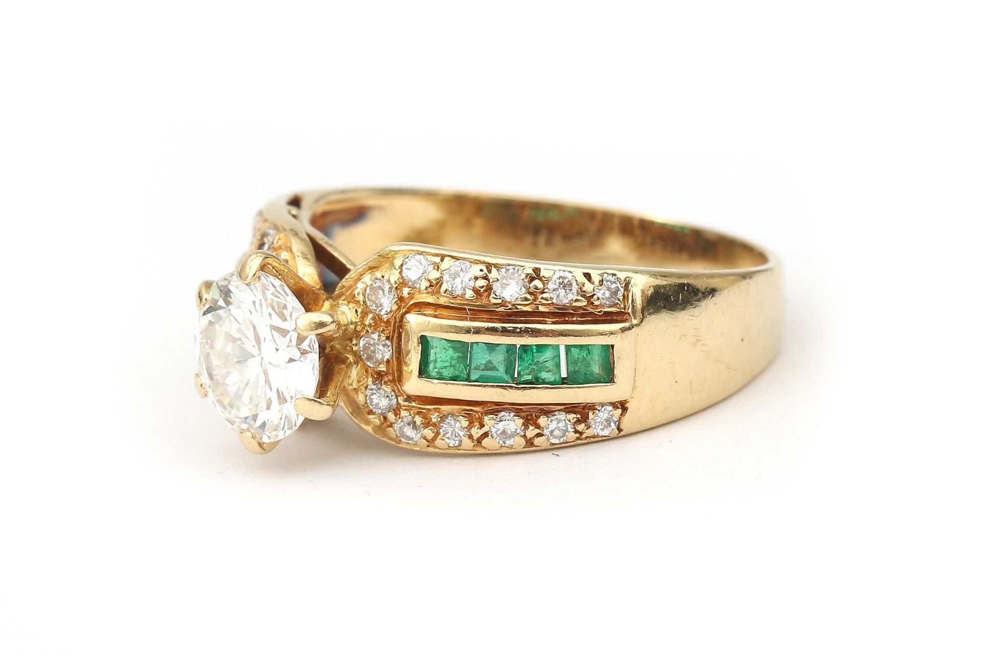 An 18 karat gold emerald and diamond solitaire ring, 1.07 ct. - Image 2 of 4