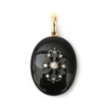 A 14 karat gold and onyx mourning locket with rose cut diamond
