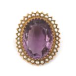 A 14 karat gold amethyst and pearl brooch