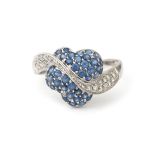 An 18 karat white gold diamond and sapphire ring