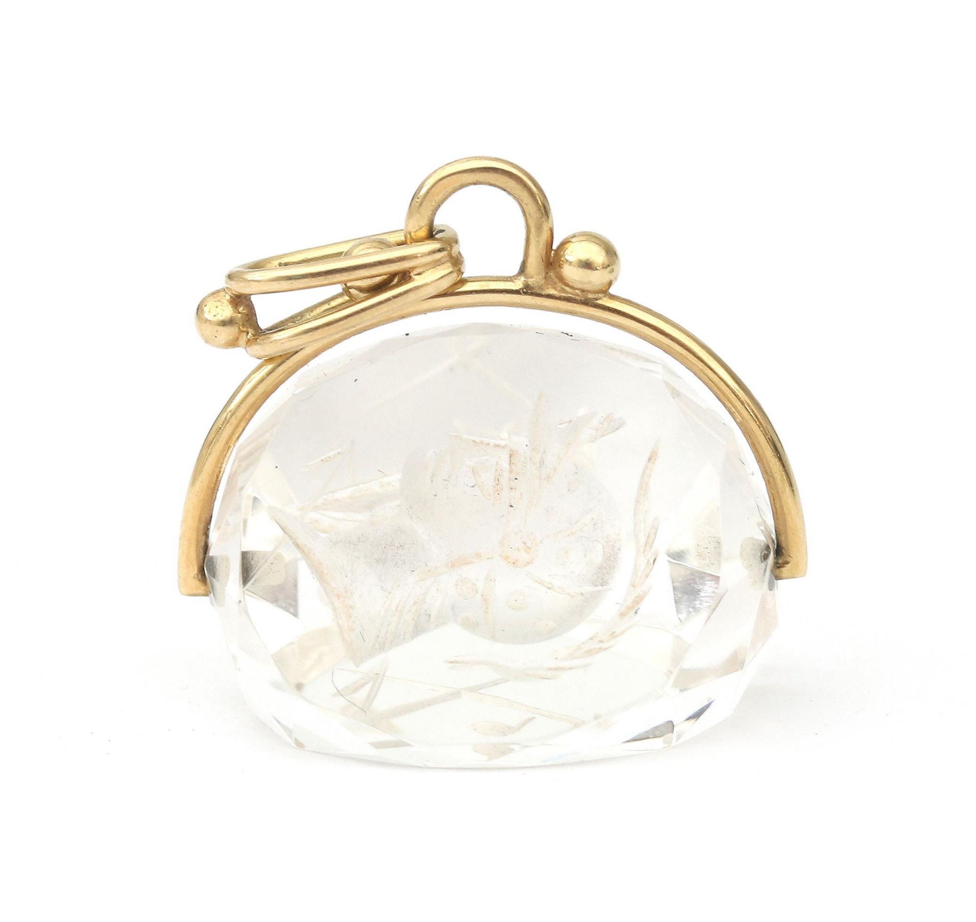 A 14 karat gold quartz fob swivle pendant